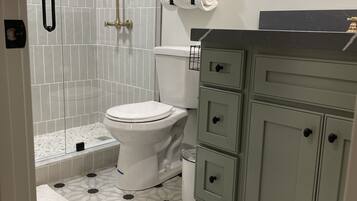 Shower, hair dryer, towels, soap