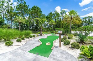 Enjoy a round of golf surrounded by lush greenery and well-manicured fairways.
