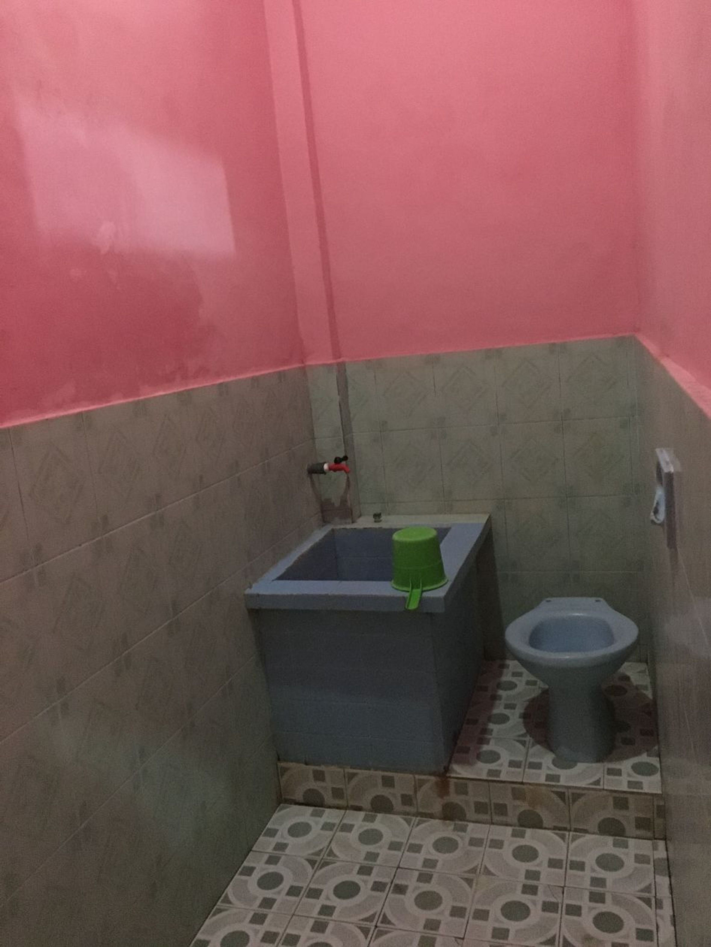 A small bathroom with a toilet and a sink.