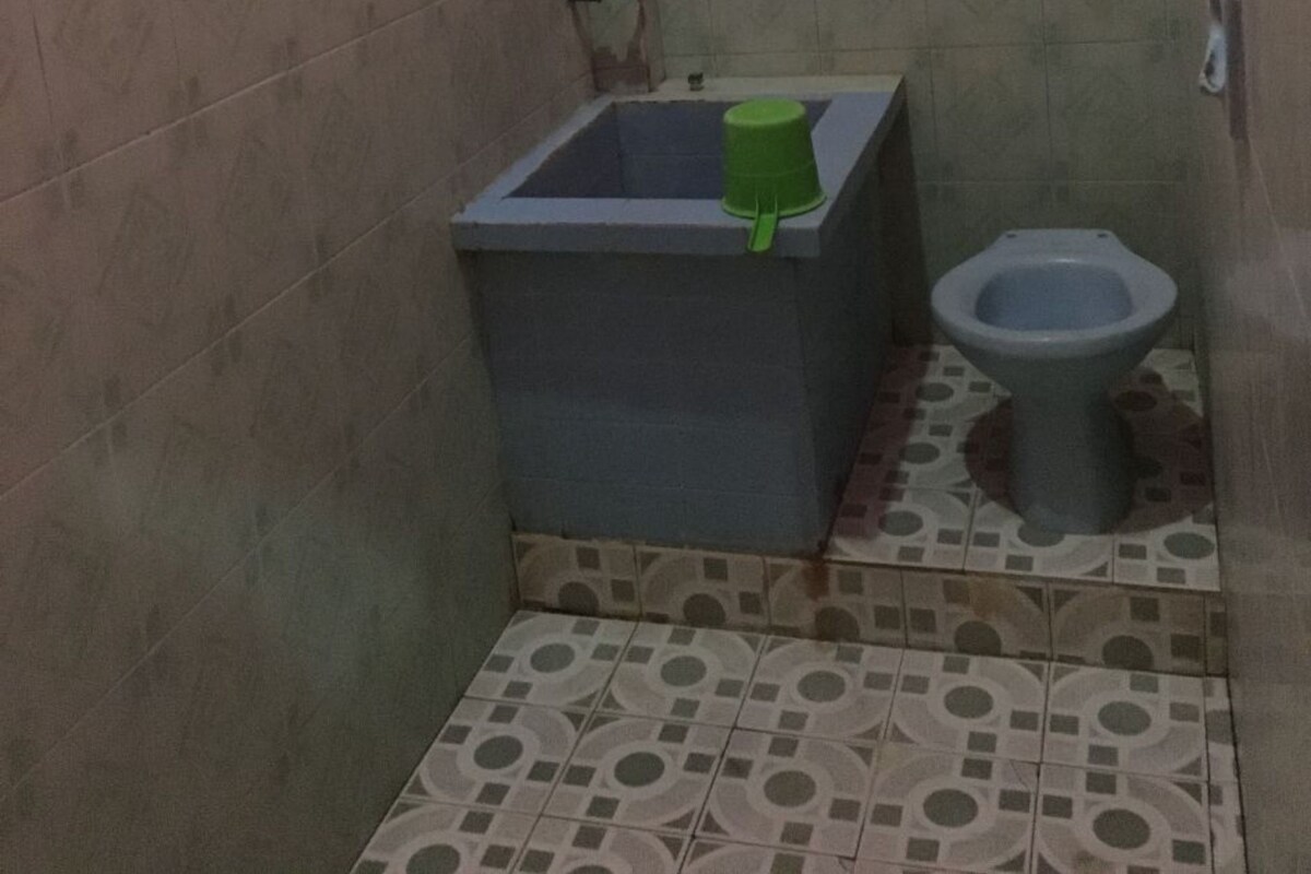 A small bathroom with a toilet and a sink.