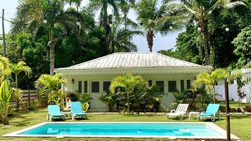 Outdoor pool, open 9:00 AM to 9:00 PM, pool umbrellas, pool loungers