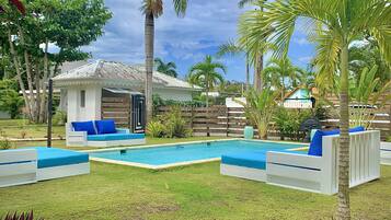 Outdoor pool, open 9:00 AM to 9:00 PM, pool umbrellas, pool loungers