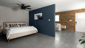 Un dormitorio moderno con cama, ventilador de techo, pared de madera y una puerta.