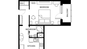 A floor plan of a hotel room with a bedroom, balcony, bathroom, and kitchen. - Small one room apartment with balcony (Humenné)
