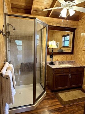 Shower, hair dryer, towels, toilet paper