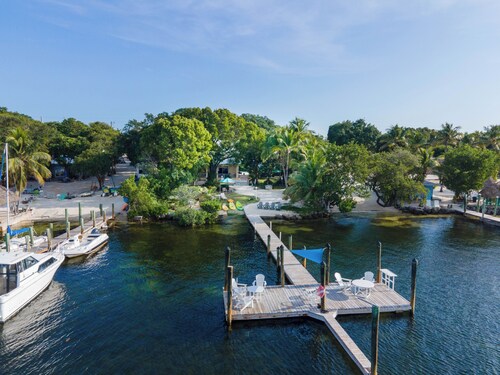 Tropical bayfront villa with sandy beach