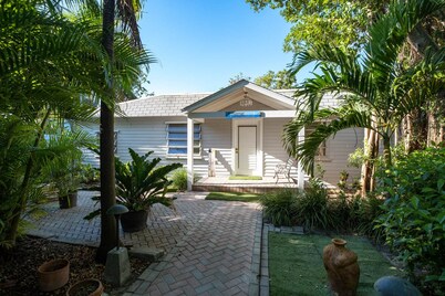 Tropical bayfront villa with sandy beach