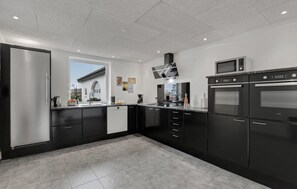 Fridge, stovetop, dishwasher, coffee/tea maker