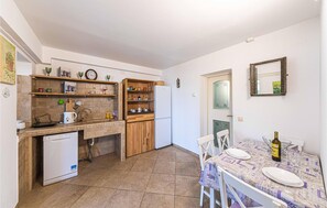 Fridge, dishwasher, coffee/tea maker, cookware/dishes/utensils