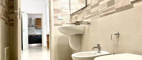 Bathtub, hair dryer, towels
