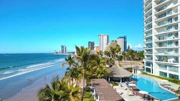 On the beach, sun loungers, beach towels