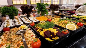 A buffet with various dishes including salads, beans, and vegetables. - Four Sides Hotel (Istanbul)