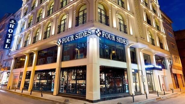 A multi-story hotel with a prominent 'Four Sides' sign, large windows, and a classic architectural style. - Four Sides Hotel (Istanbul)