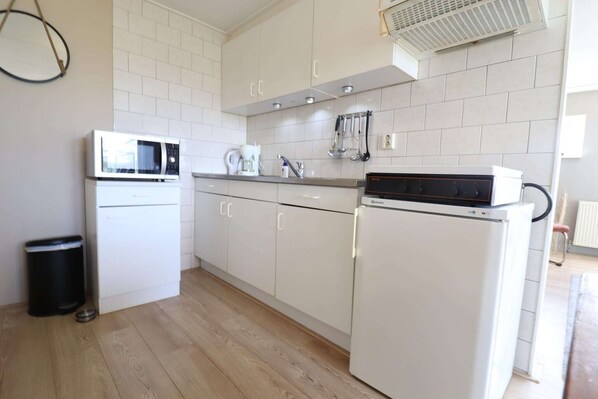 Fridge, microwave, stovetop, coffee/tea maker