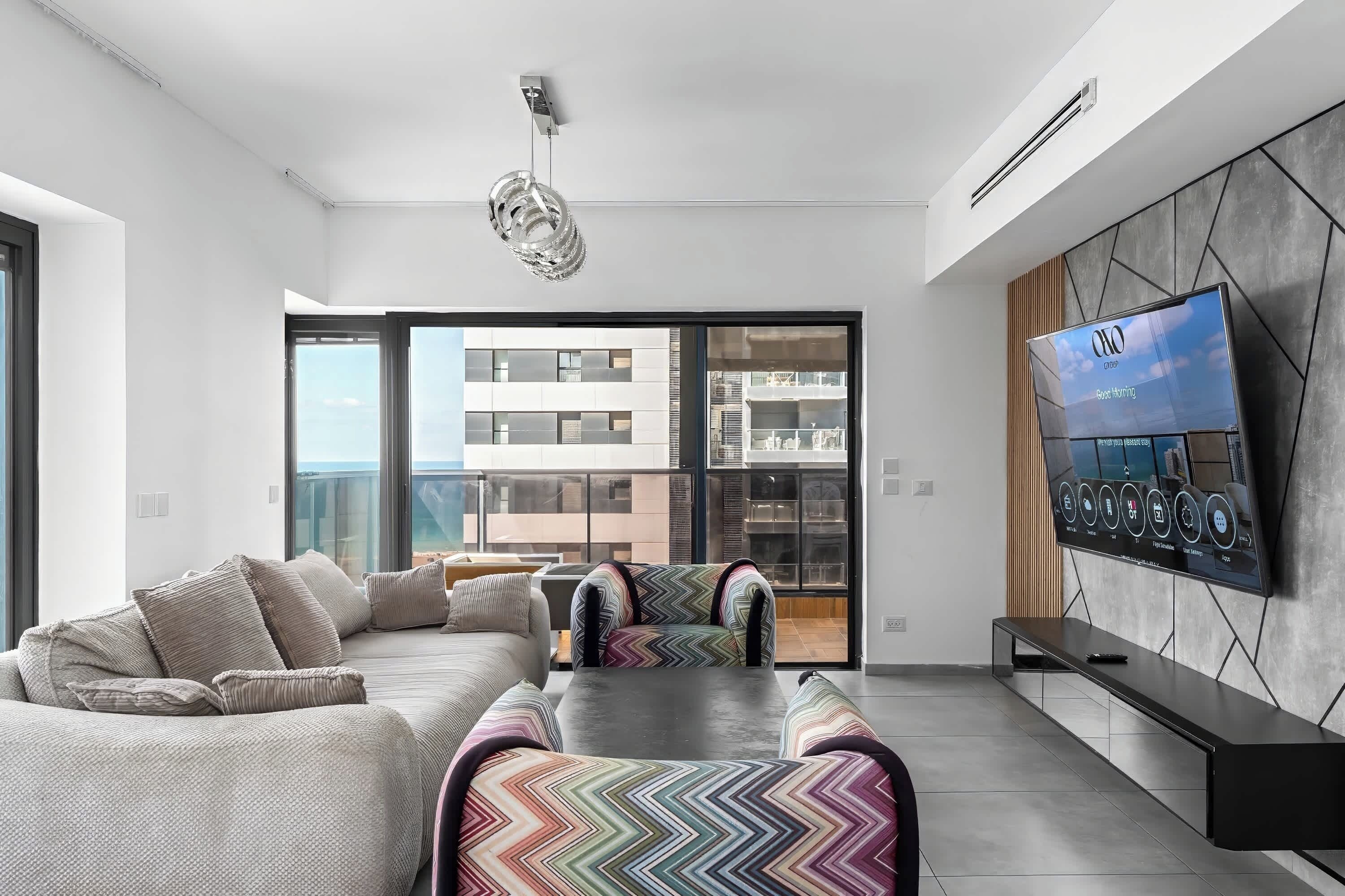 Spacious lounge with plush seating invites evenings together after beach walks and nearby dining adventures.