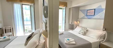 Desk, laptop workspace, free WiFi, bed sheets