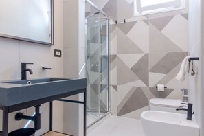 Shower, hair dryer, bidet, toilet paper