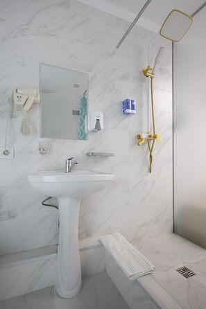 A modern bathroom with a white sink, mirror, and shower. - ololoAkJol (Kosh-Kel)