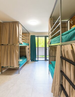 A dormitory room with bunk beds, a sliding door to a balcony, and a tiled floor. - ololoAkJol (Kosh-Kel)