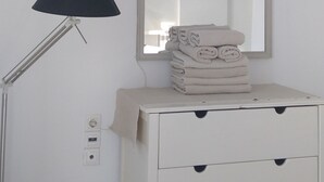 A white bedside table with a mirror and a lamp. - 3-room House With Sea View (Ierapetra)