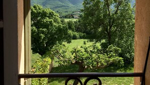 A balcony with a view of a green valley and hills. - Lavender, Luberon view, pool, air-conditioning : Villa Mas des Lavandes 2 BR. 4* (Céreste)