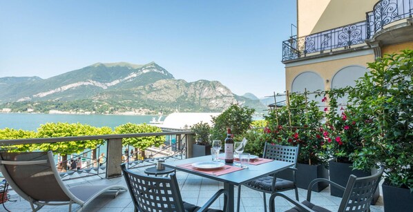 Enjoy al fresco dining with a breathtaking view of the coastal landscape and distant mountains.