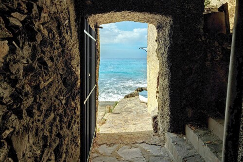 Appartement 'Lo Scoglio' avec jardin privé et Wi-Fi