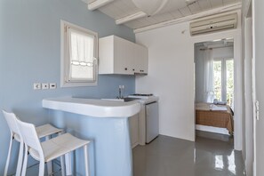 Interior - Apartment In A Hotel 'Ninemia Suites Tinos Grand 104' with Shared Pool, Wi-Fi and Air Conditioning (Kionia)