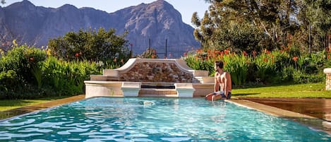 Outdoor pool, pool umbrellas, sun loungers