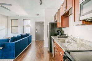 Fridge, microwave, oven, stovetop - CozySuites TWO Music Row Condos with parking (Nashville)