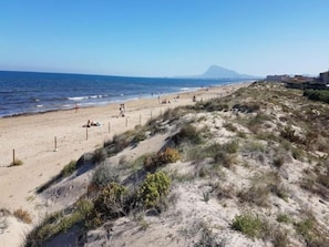 Guests can enjoy access to the sandy beach and scenic views of the surrounding landscape.