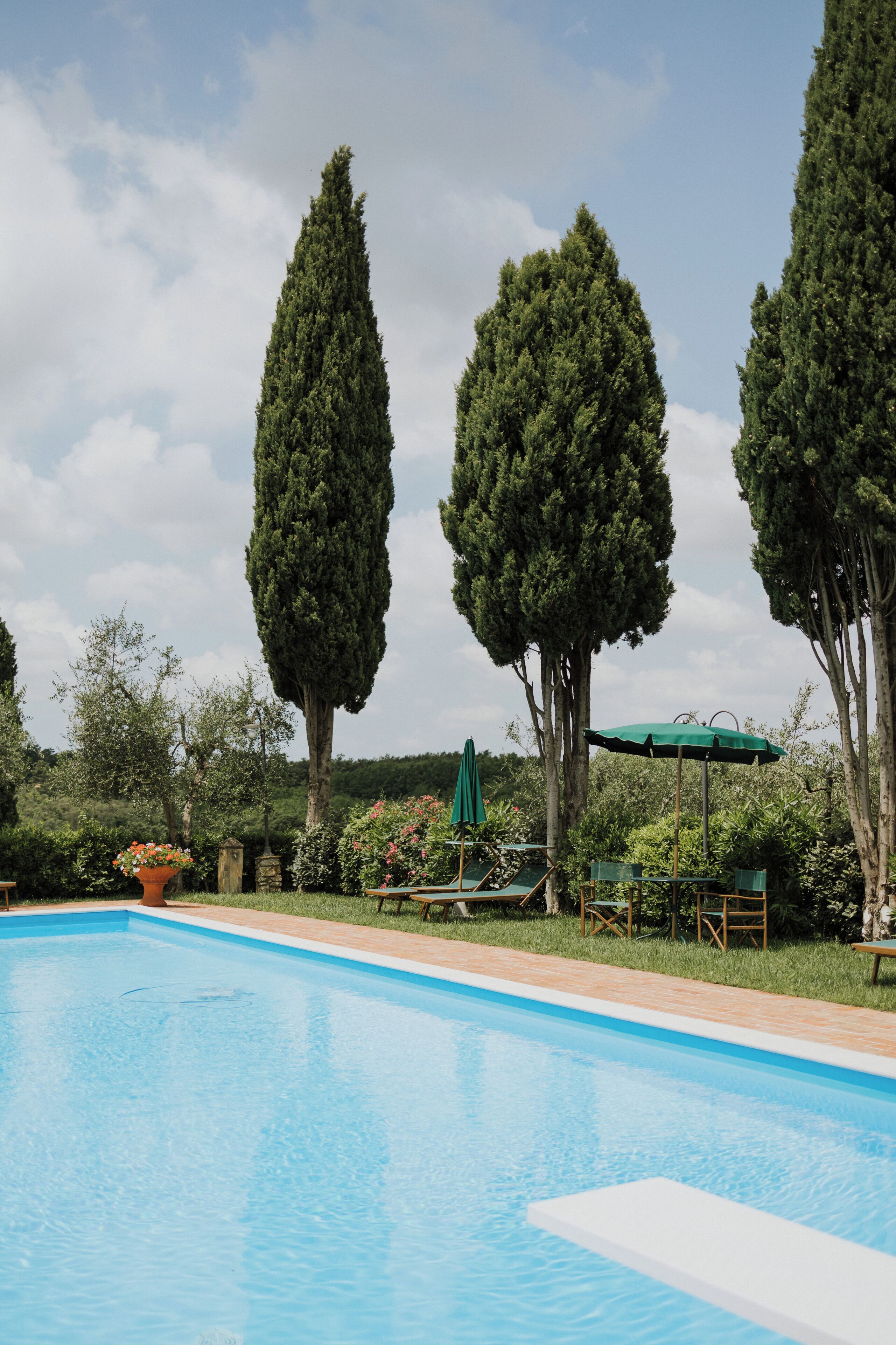 Seasonal outdoor pool, pool umbrellas, pool loungers