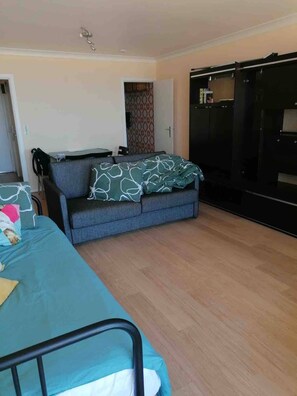 Appartement, 1 queensize bed met slaapbank | Woonruimte