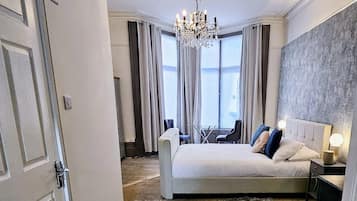 Deluxe Studio | Desk, laptop workspace, blackout curtains, iron/ironing board
