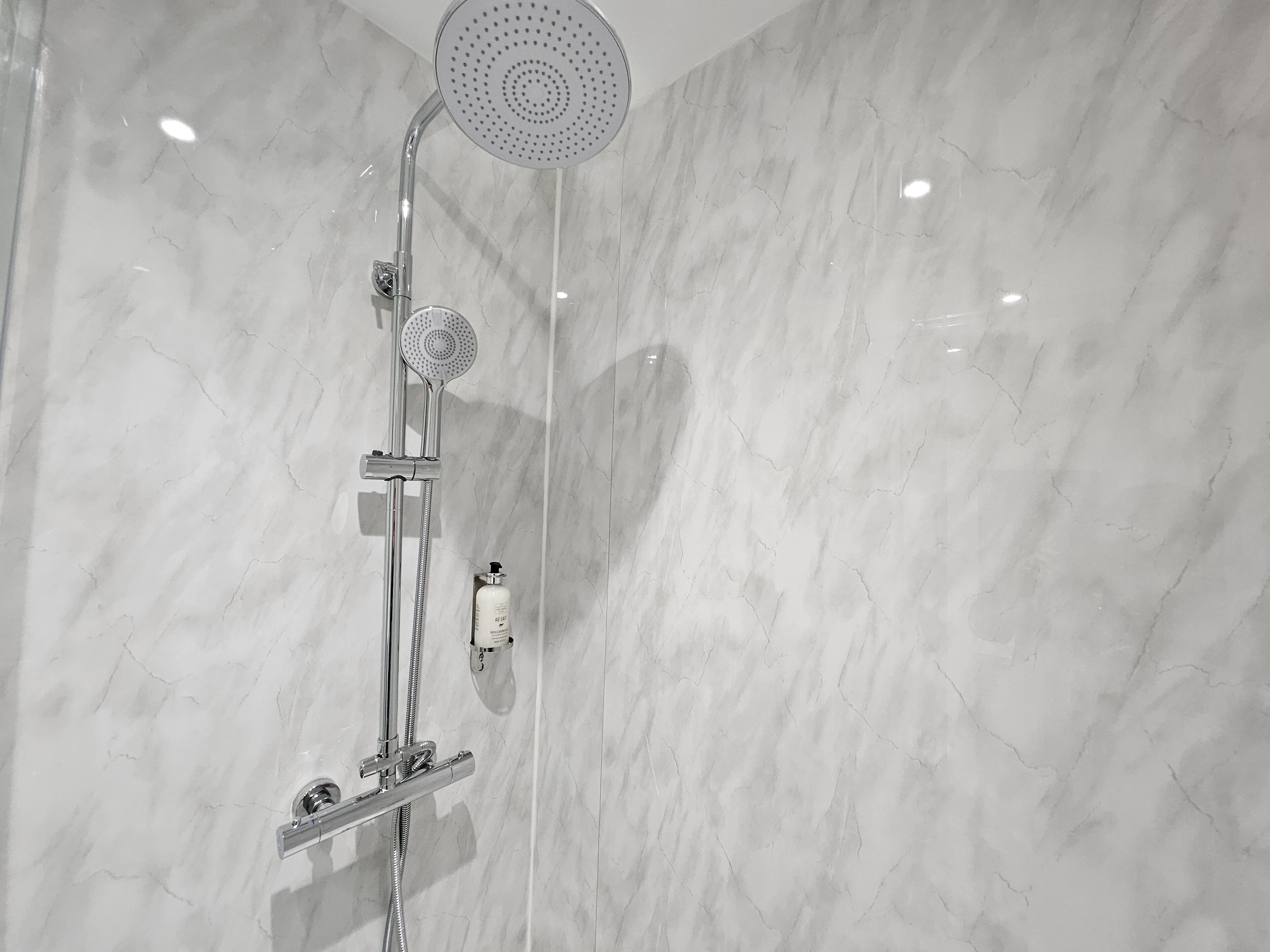 Deluxe Studio | Bathroom | Shower, hair dryer, towels, soap