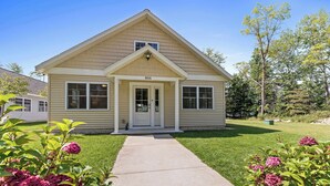 A single-story house with a front door, windows, and a number '806' on the door. - Two Homes: 1-Hot Tub; 2-Lakefront w/Dock, Big Yard (Pullman)