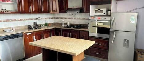 Oven, stovetop, cookware/dishes/utensils, dining tables