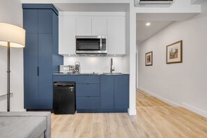 Fridge, microwave, coffee/tea maker, cookware/dishes/utensils