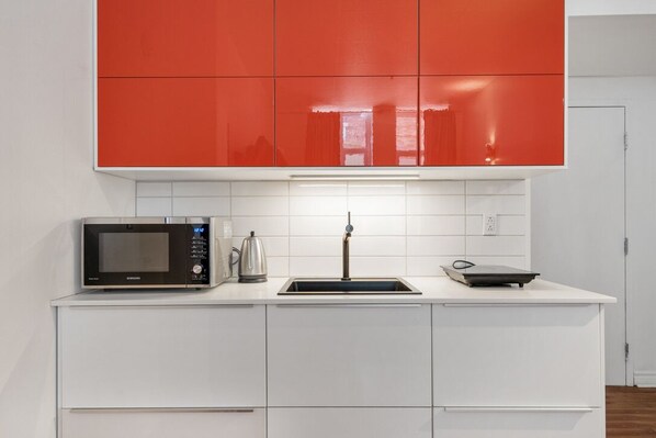 Fridge, microwave, cookware/dishes/utensils