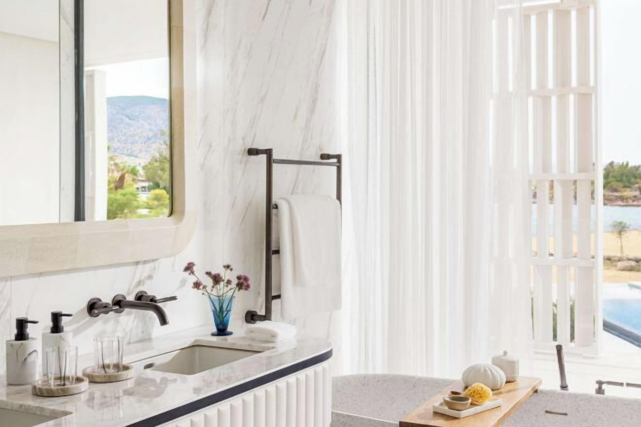 Separate tub and shower, rainfall showerhead, hair dryer, bathrobes