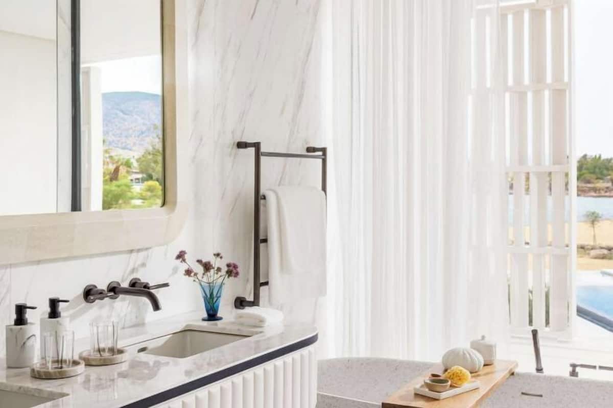 Separate tub and shower, rainfall showerhead, hair dryer, bathrobes