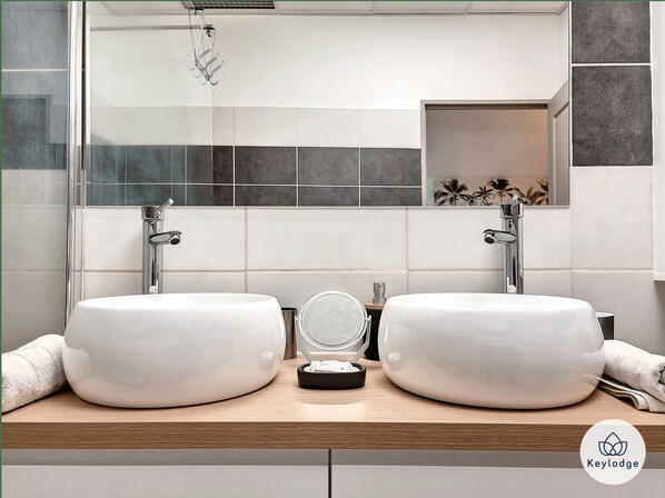 Shower, hair dryer, towels, soap