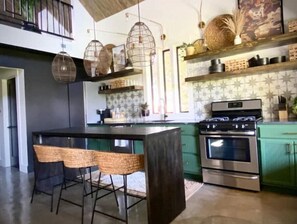 Enjoy cooking in this well-equipped kitchen with a central island and oven.