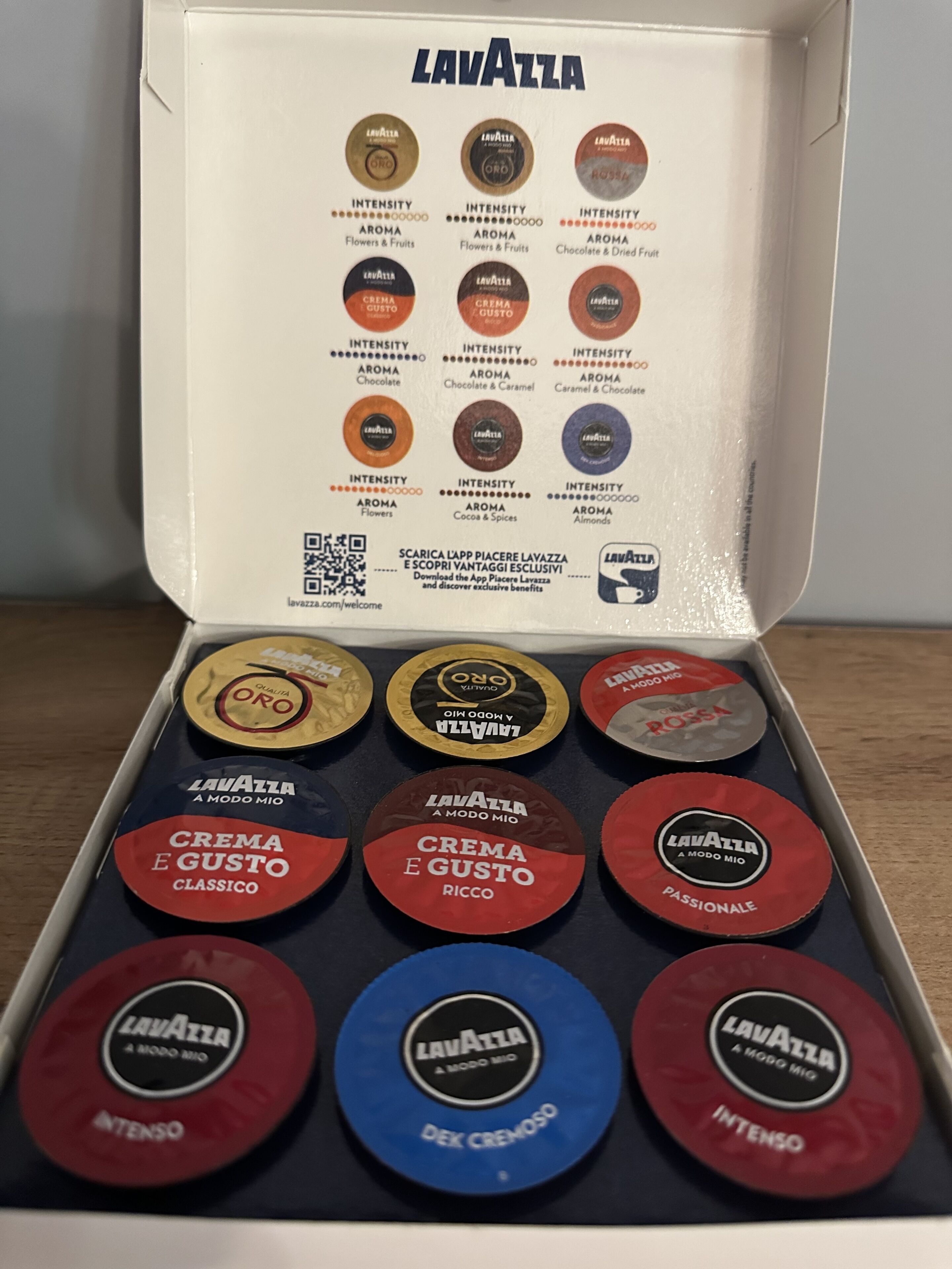 A Lavazza coffee box with various coffee pods.