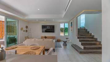 Deluxe Villa, 3 Bedrooms, Pool Access (Sea Turtle) | Living room | 70-inch Smart TV with digital channels