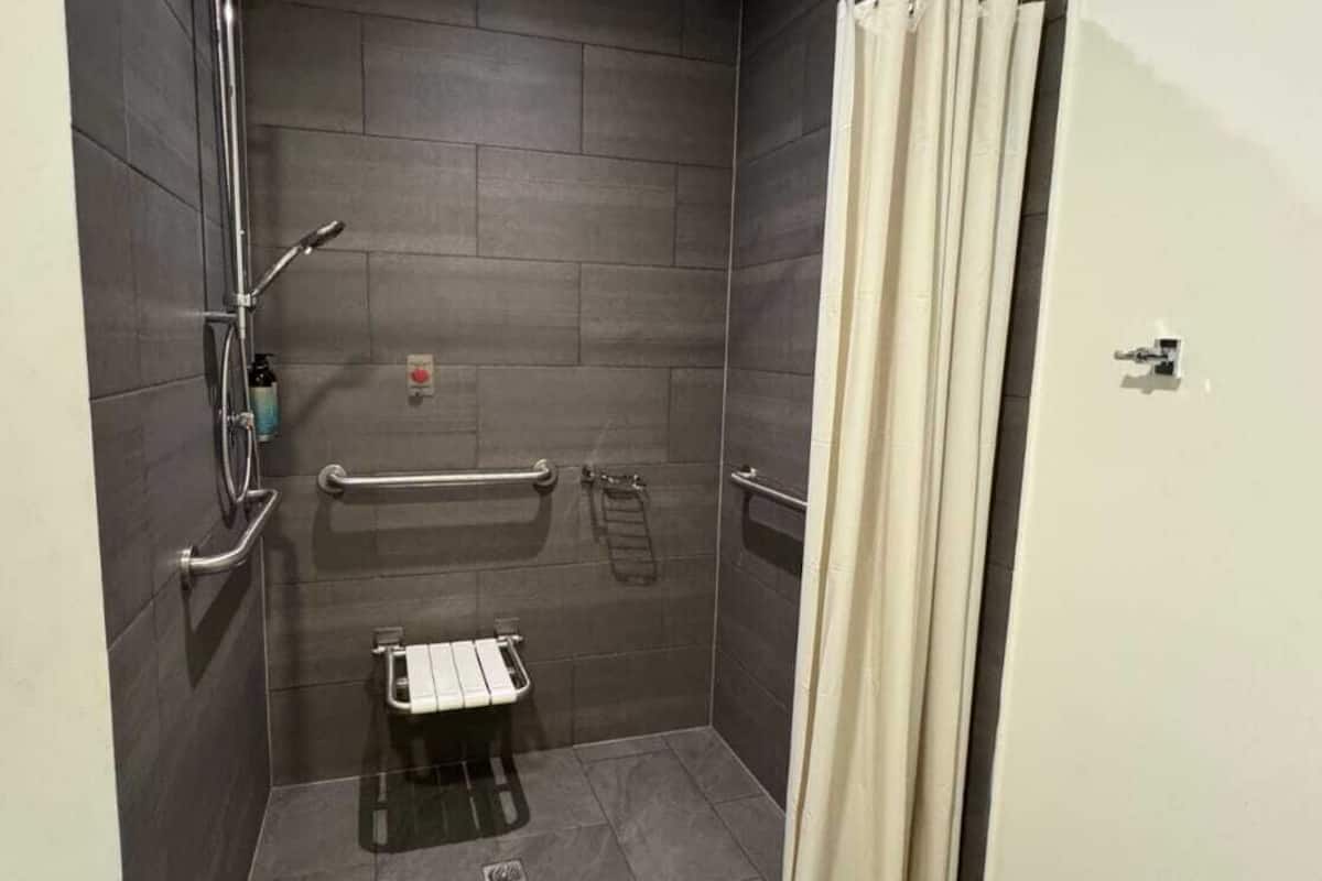 accessible room | bathroom | shower, rainfall showerhead, hair dryer, towels