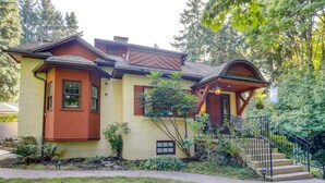A two-story house with a brown roof, beige walls, and a front porch. - 1 Mi to Park & Waterfront! Seattle Home w/ Balcony (Seattle)