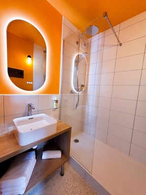 Shower, eco-friendly toiletries, hair dryer, towels