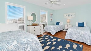 A bedroom with two beds, a ceiling fan, and a window with blinds. - 215 Cedar Street Unit 4 Rose Garden - Lewes Beach (Lewes)