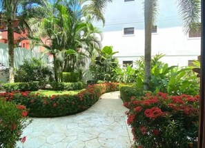 Stroll through the serene garden, surrounded by vibrant blooms and lush greenery, and discover the tranquil atmosphere.